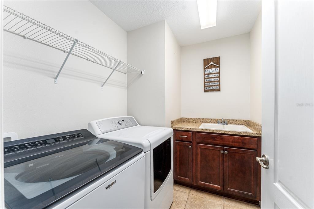 9961 Southwest 55th Ave Road Ocala, FL 34476 - Photo 50 of 89 a utility room with dryer and washer