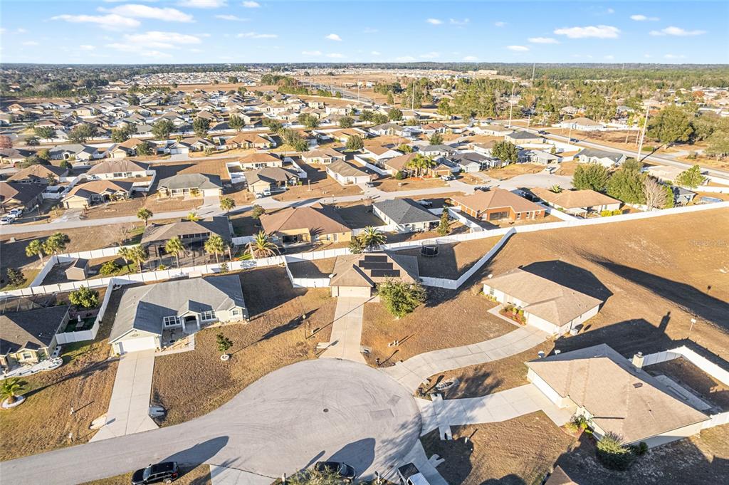 9961 Southwest 55th Ave Road Ocala, FL 34476 - Photo 72 of 89 an aerial view of residential houses with outdoor space