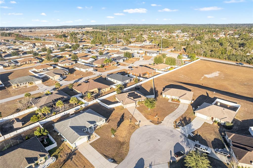 9961 Southwest 55th Ave Road Ocala, FL 34476 - Photo 73 of 89 an aerial view of residential houses with outdoor space