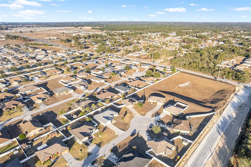 9961 Southwest 55th Ave Road Ocala, FL 34476 - Photo 74 of 89 an aerial view of residential building with parking space