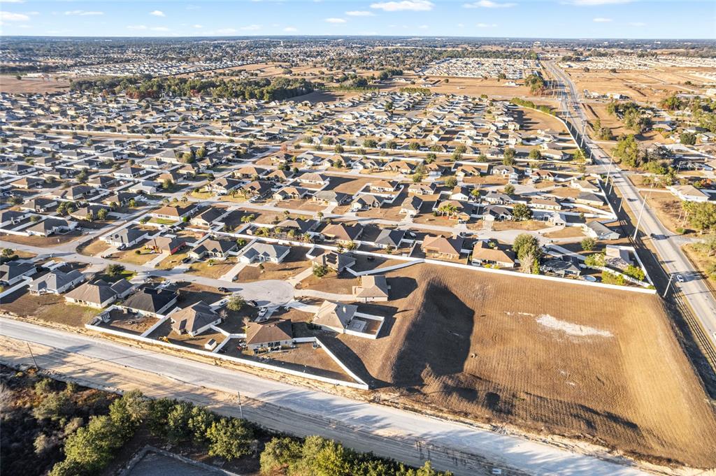 9961 Southwest 55th Ave Road Ocala, FL 34476 - Photo 75 of 89 an aerial view of residential building and parking space