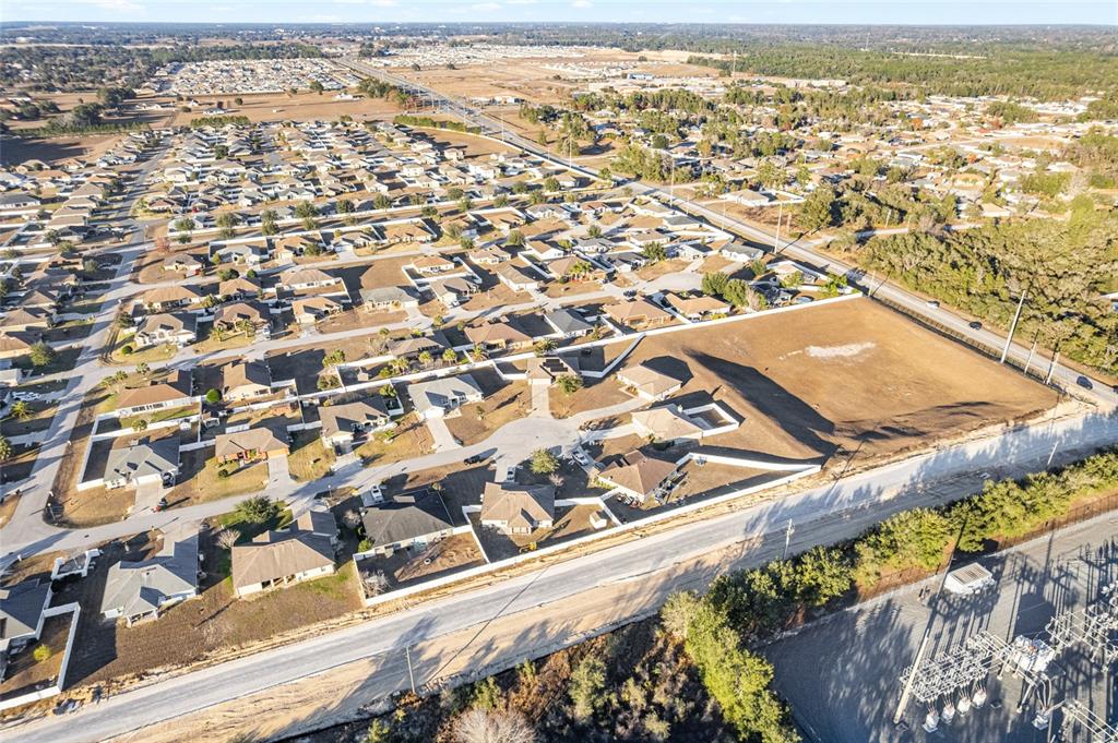 9961 Southwest 55th Ave Road Ocala, FL 34476 - Photo 76 of 89 an aerial view of residential building and ocean view