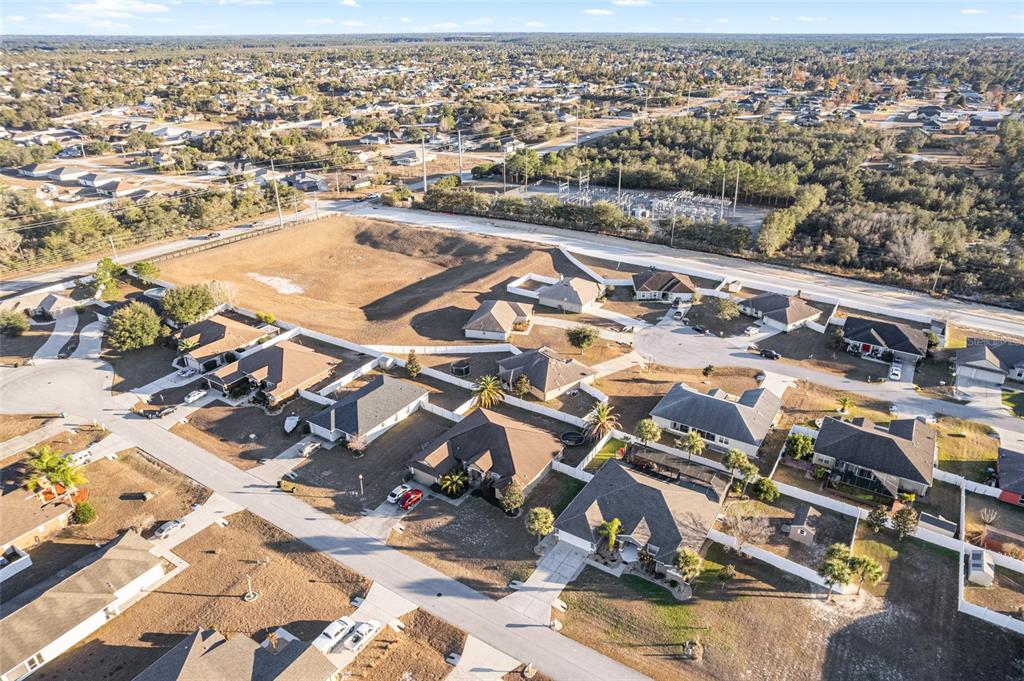 9961 Southwest 55th Ave Road Ocala, FL 34476 - Photo 83 of 89 an aerial view of residential houses with outdoor space