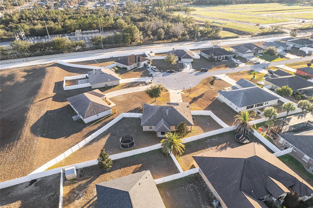 9961 Southwest 55th Ave Road Ocala, FL 34476 - Photo 86 of 89 an aerial view of residential houses with outdoor space