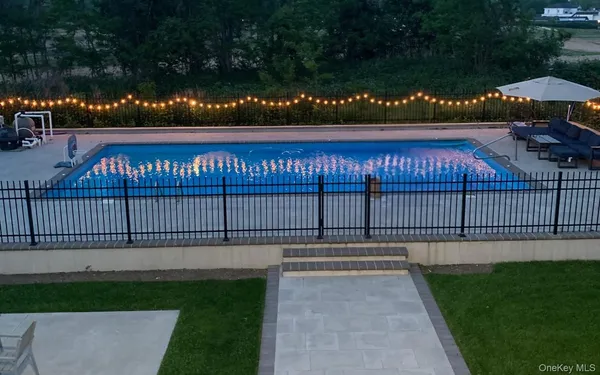 swimming pool with a yard