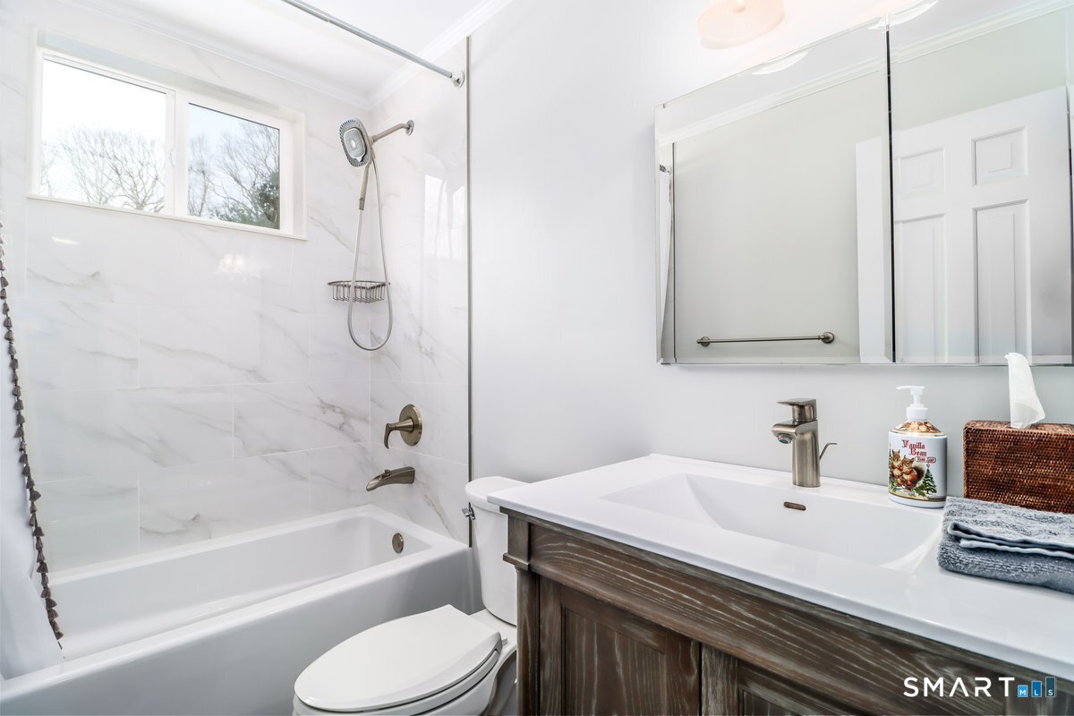 16 A Pole Bridge Road Newtown, CT 06482 - Photo 13 of 27 a bathroom with a sink a toilet and a bathtub