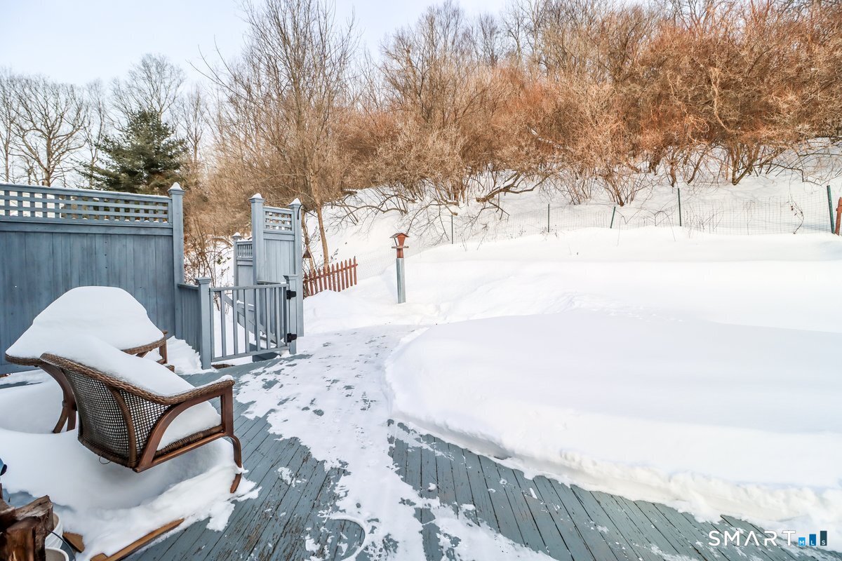 16 A Pole Bridge Road Newtown, CT 06482 - Photo 24 of 27 a view of a terrace with chairs and wooden fence