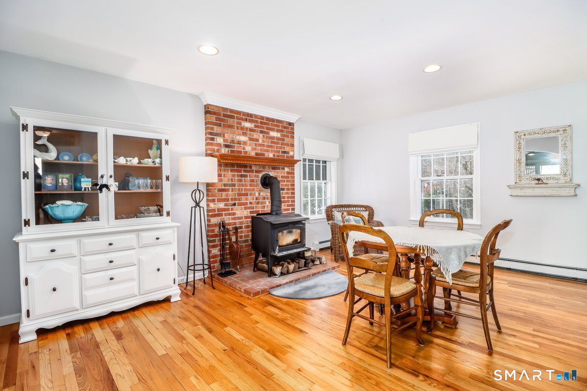 16 A Pole Bridge Road Newtown, CT 06482 - Photo 7 of 27 a living room with furniture and wooden floor