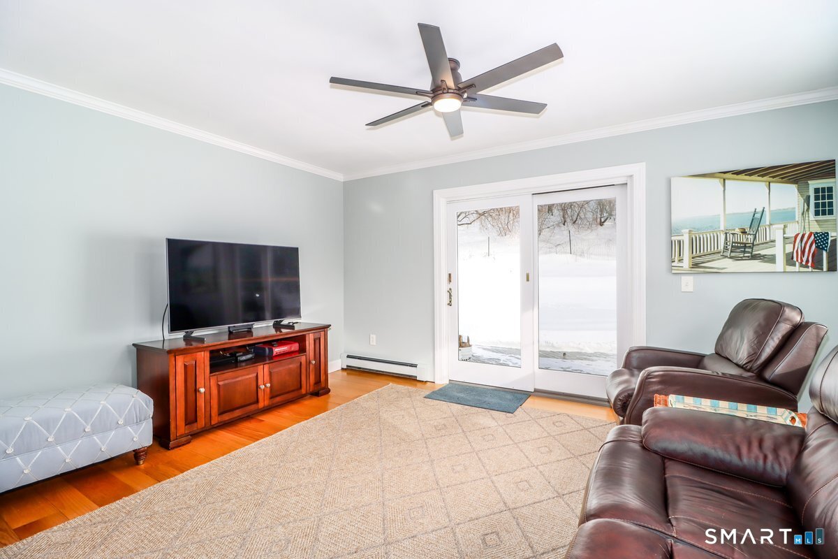 16 A Pole Bridge Road Newtown, CT 06482 - Photo 10 of 27 a bedroom with furniture and a flat screen tv