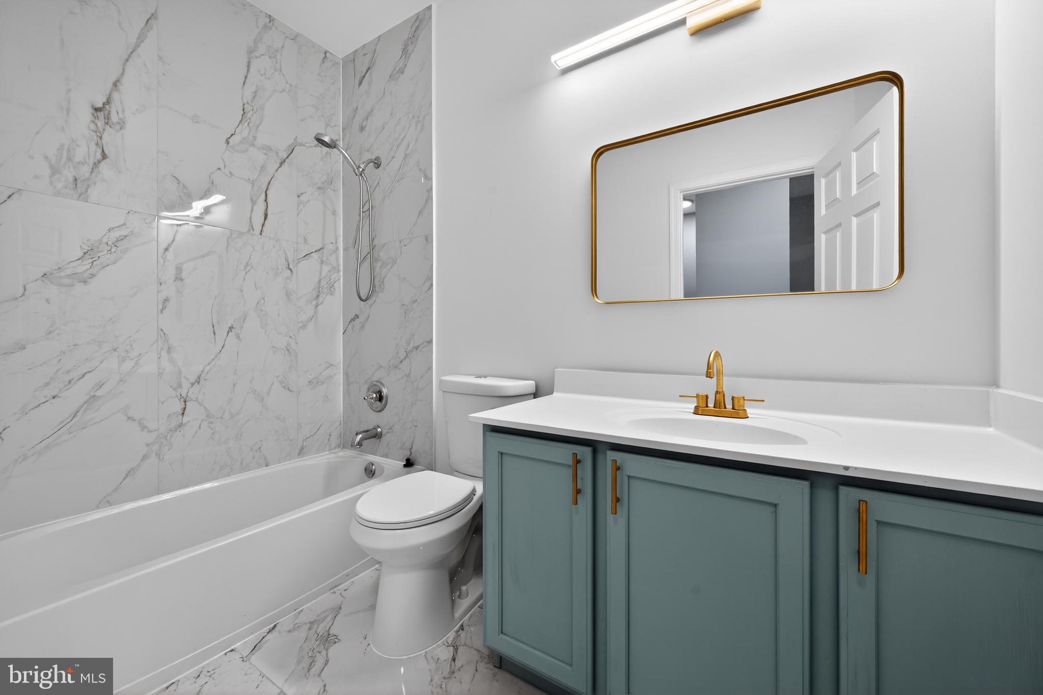 3 Swan Court Delran, NJ 08075 - Photo 21 of 34 a bathroom with a granite countertop sink a toilet and a mirror