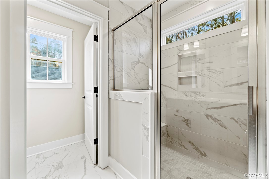 10010 Bo Trail Mechanicsville, VA 23116 - Photo 11 of 16 a bathroom with a glass shower door