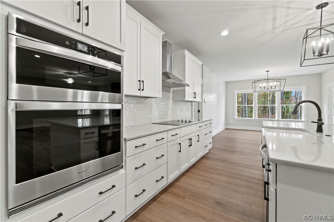 10010 Bo Trail Mechanicsville, VA 23116 - Photo 4 of 16 a kitchen with granite countertop white cabinets and stainless steel appliances
