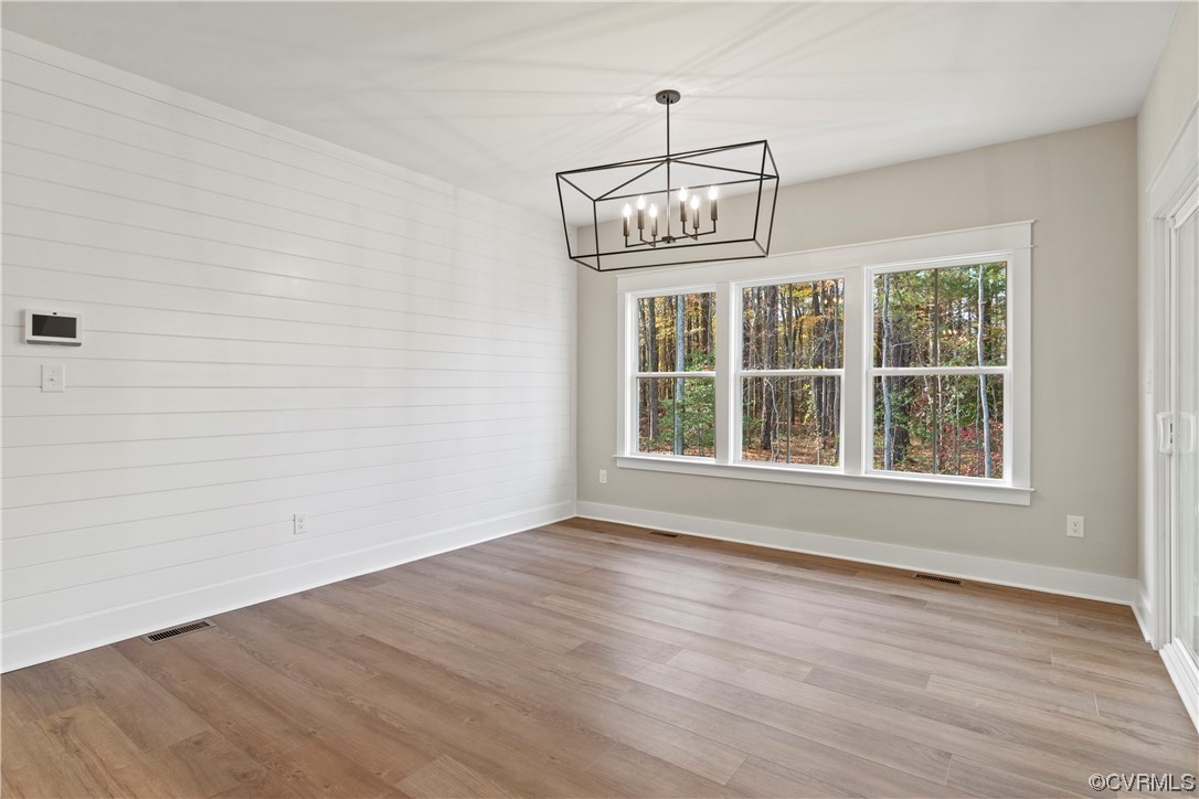 10010 Bo Trail Mechanicsville, VA 23116 - Photo 5 of 16 a view of empty room with wooden floor and fan