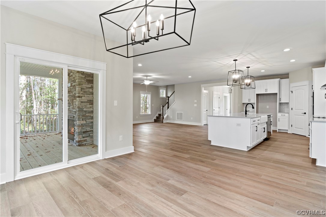 10010 Bo Trail Mechanicsville, VA 23116 - Photo 6 of 16 a view of a kitchen with a sink and wooden floor
