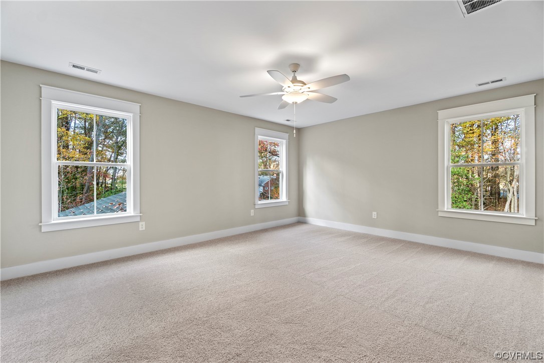 10010 Bo Trail Mechanicsville, VA 23116 - Photo 9 of 16 an empty room with a window and a ceiling fan
