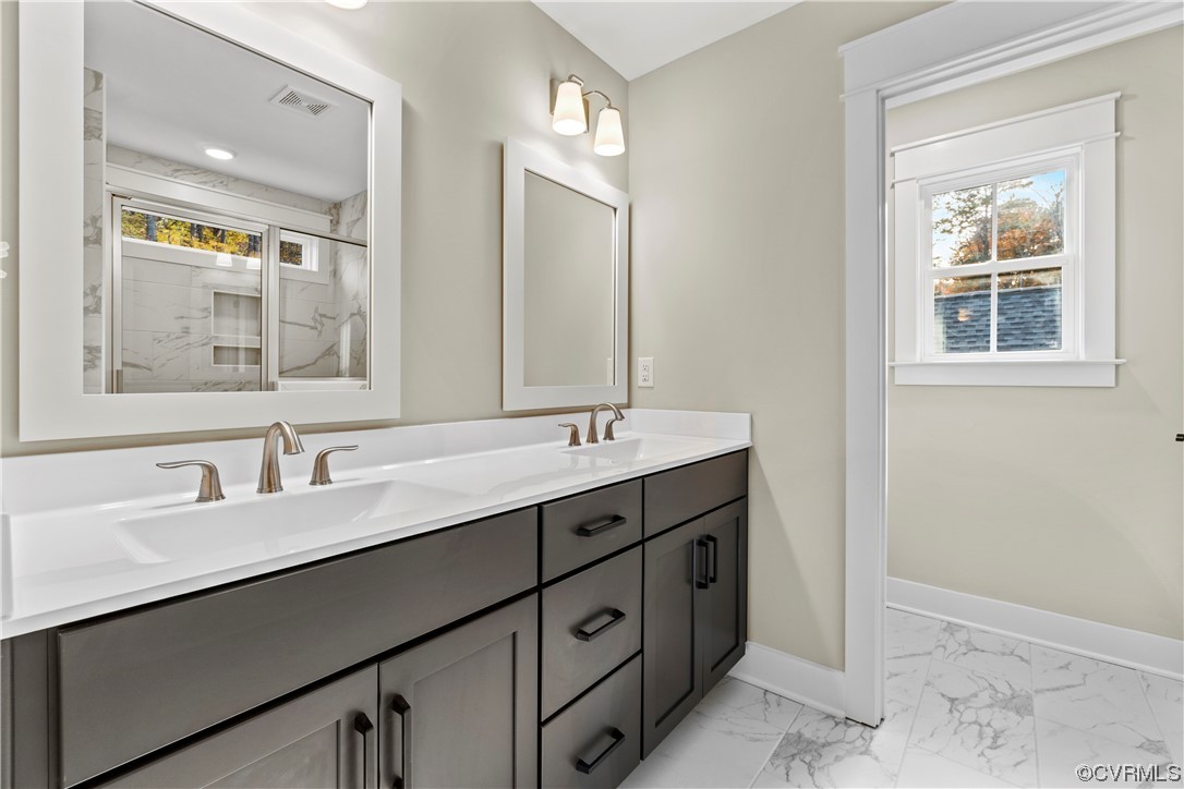 10010 Bo Trail Mechanicsville, VA 23116 - Photo 10 of 16 a bathroom with a double vanity sink and a mirror