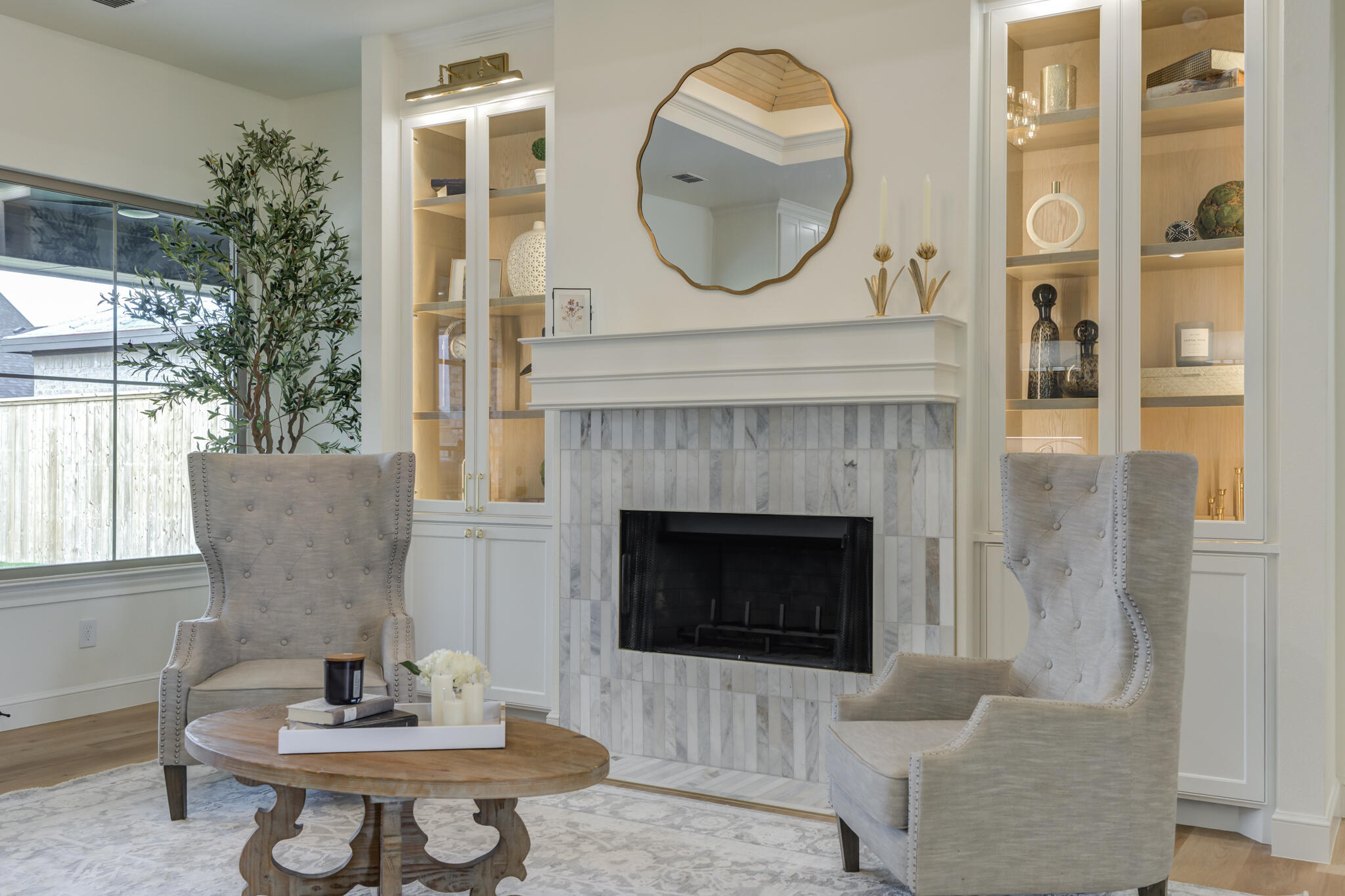 3612 143rd Street Lubbock, TX 79423 - Photo 35 of 91 a living room with furniture a mirror and a fireplace