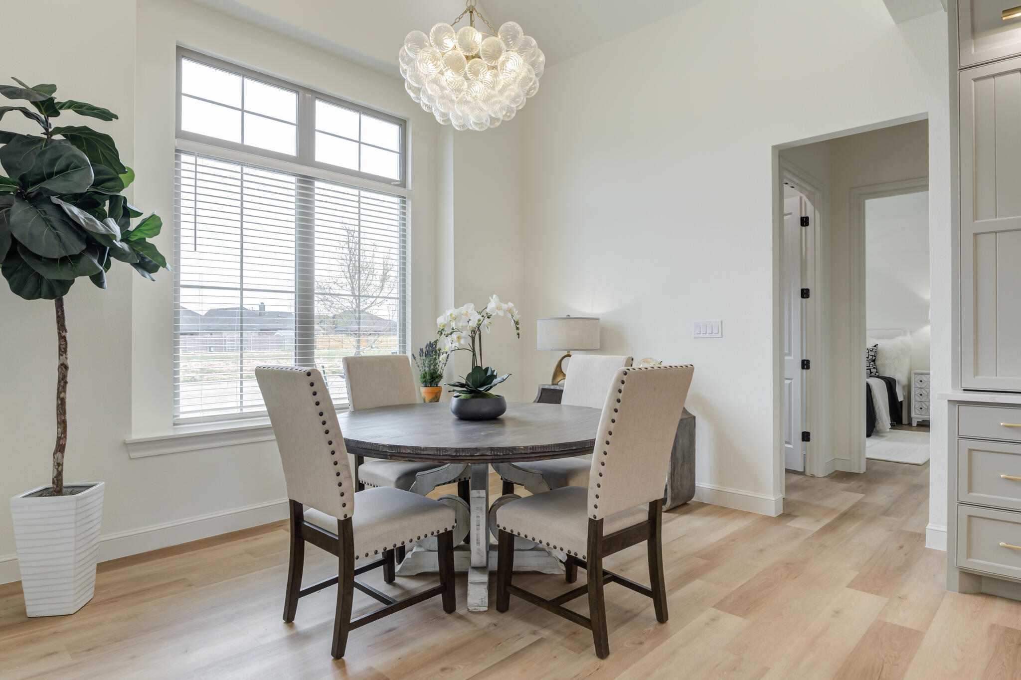 3612 143rd Street Lubbock, TX 79423 - Photo 48 of 91 a view of a dining room with furniture a chandelier and wooden floor