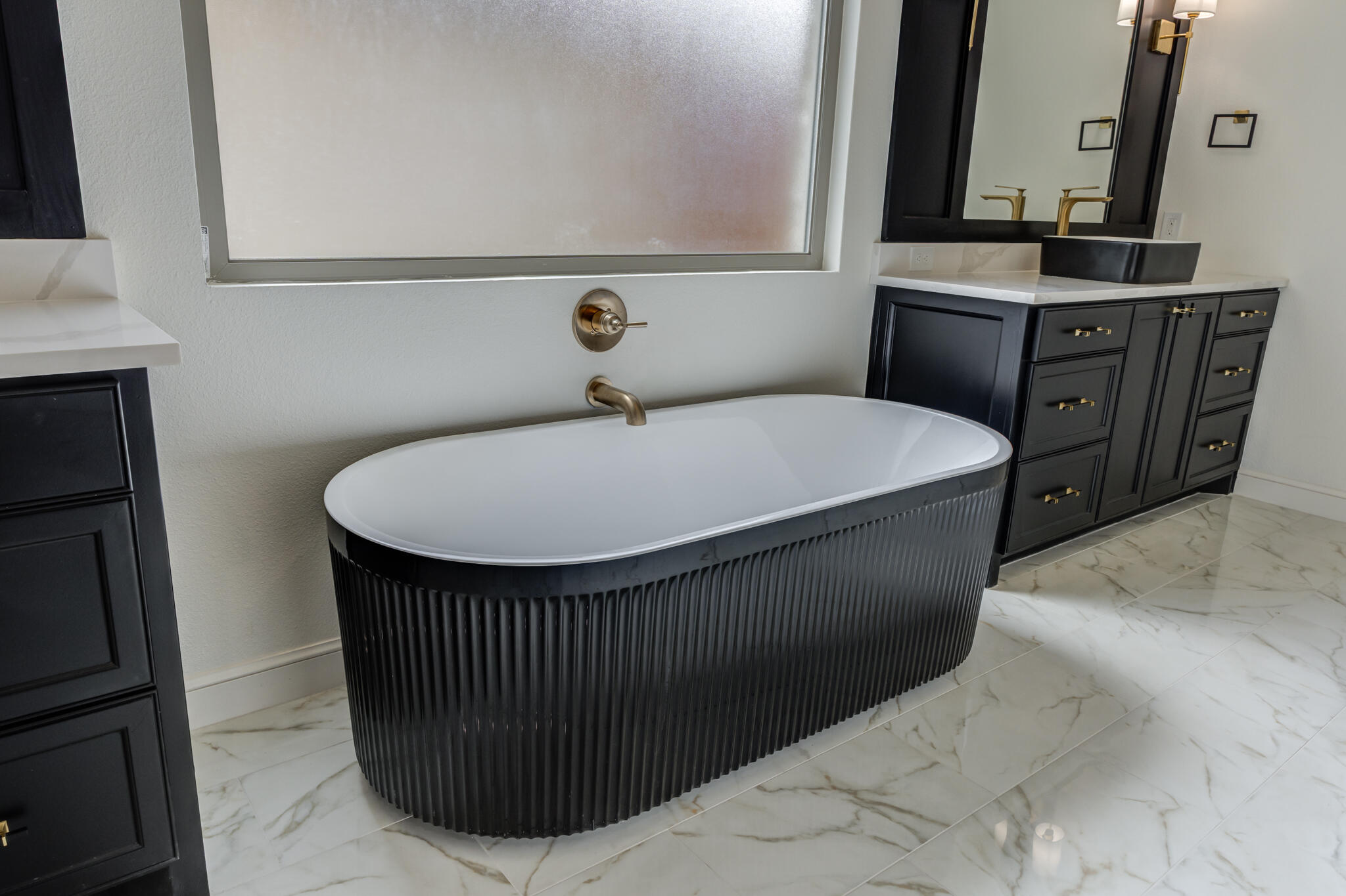 3612 143rd Street Lubbock, TX 79423 - Photo 75 of 91 a bathroom with a sink and a mirror