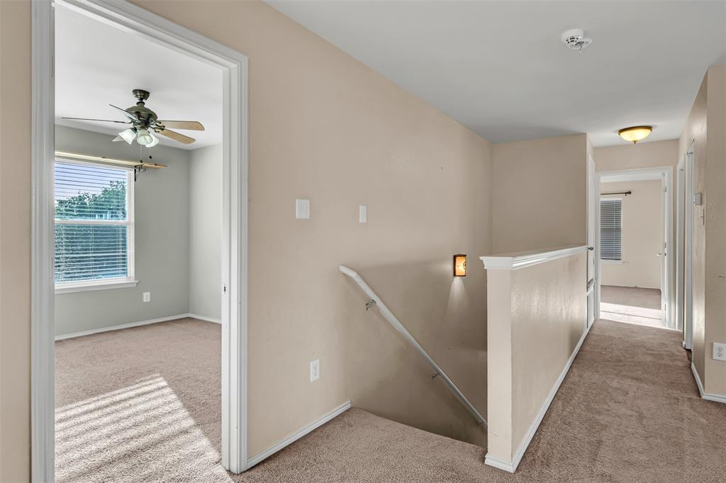 9017 Graywolf Ridge Trail Fort Worth, TX 76244 - Photo 15 of 27 Hallway with light carpet
