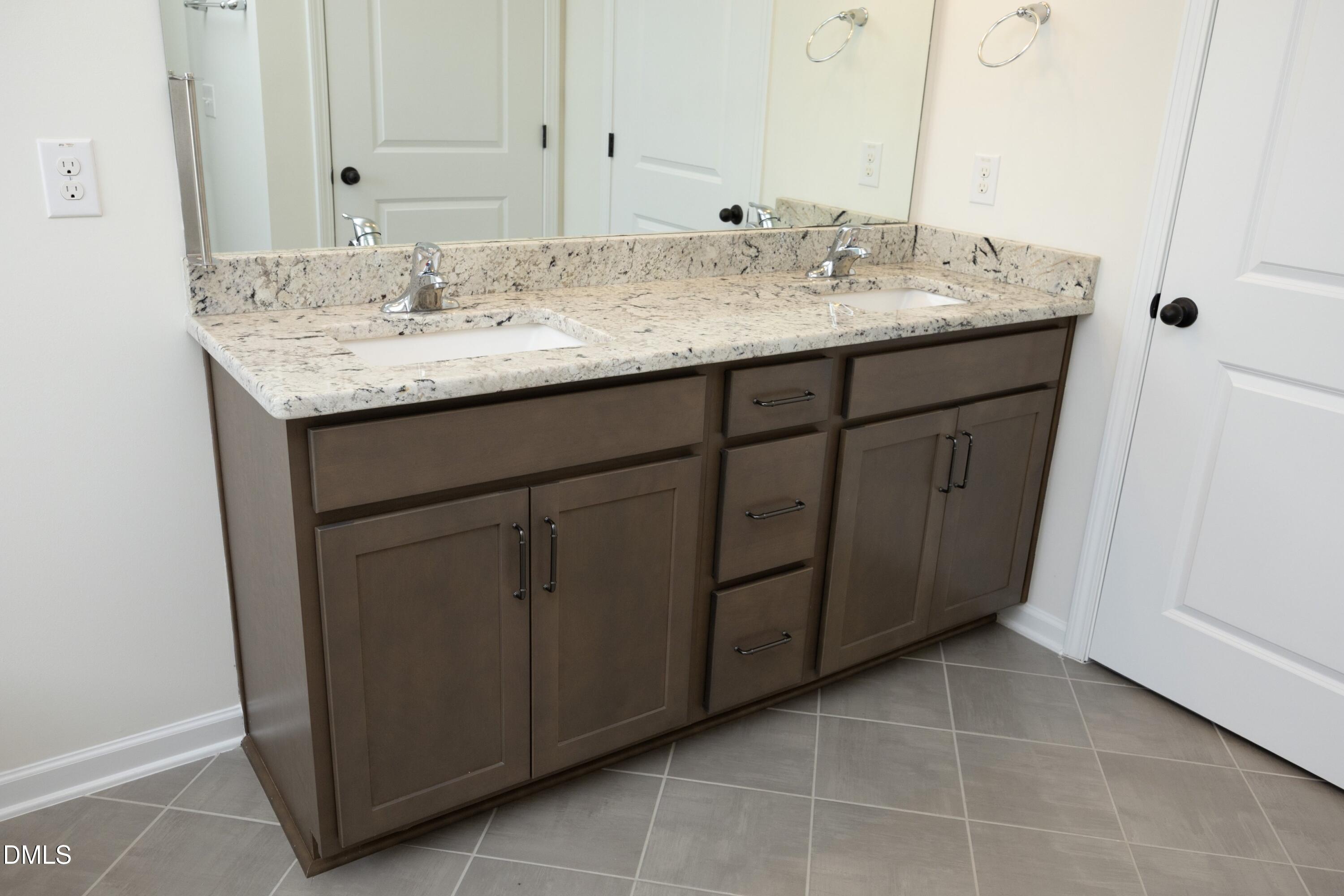 824 Country Downs Road Wake Forest, NC 27587 - Photo 25 of 41 a bathroom with a sink and a mirror