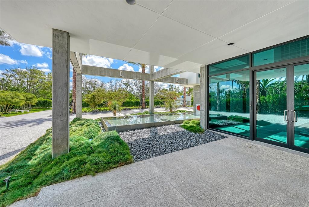 8250 Sanderling Road Sarasota, FL 34242 - Photo 11 of 61 a view of a house with backyard and porch
