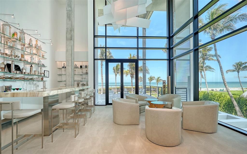 8250 Sanderling Road Sarasota, FL 34242 - Photo 16 of 61 a living room with furniture and a large window