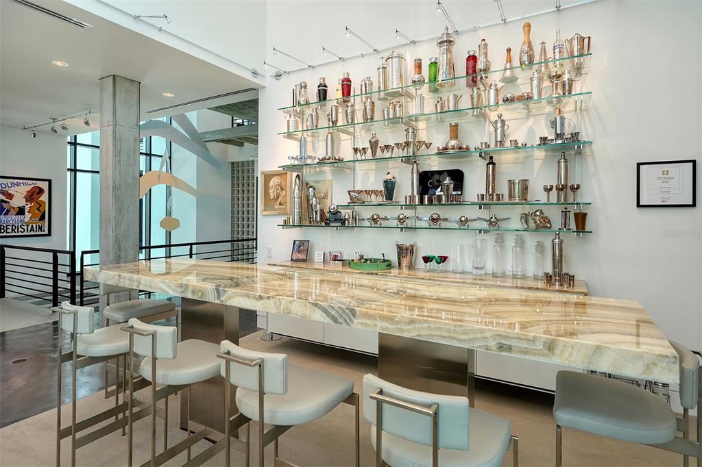 8250 Sanderling Road Sarasota, FL 34242 - Photo 18 of 61 a kitchen with stainless steel appliances granite countertop a sink and cabinets