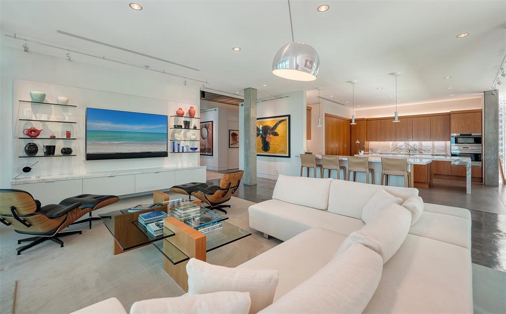 8250 Sanderling Road Sarasota, FL 34242 - Photo 21 of 61 a living room with furniture kitchen view and a large window