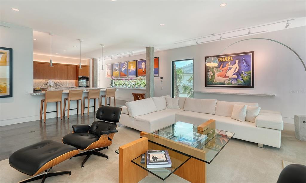 8250 Sanderling Road Sarasota, FL 34242 - Photo 22 of 61 a living room with furniture and a flat screen tv