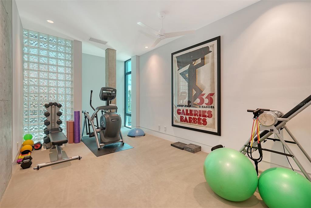 8250 Sanderling Road Sarasota, FL 34242 - Photo 33 of 61 a view of a room with gym equipment