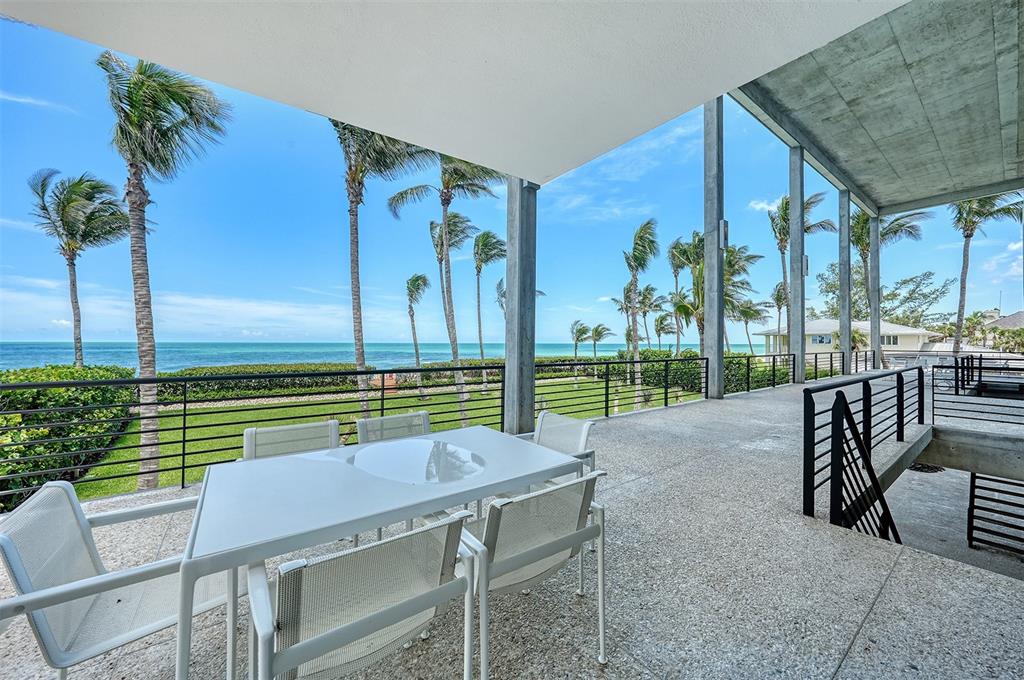 8250 Sanderling Road Sarasota, FL 34242 - Photo 37 of 61 a view of a chairs and table in the patio