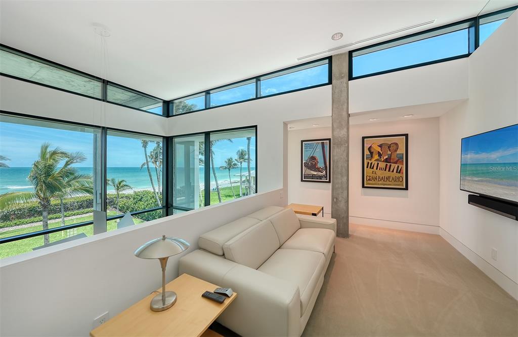 8250 Sanderling Road Sarasota, FL 34242 - Photo 41 of 61 a living room with furniture and a flat screen tv