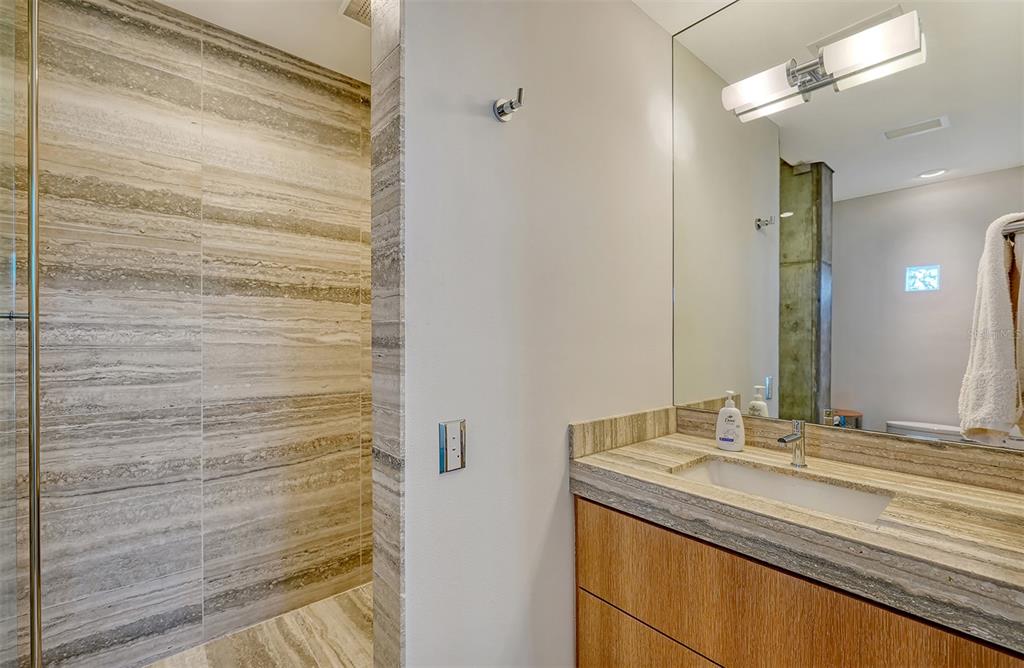 8250 Sanderling Road Sarasota, FL 34242 - Photo 43 of 61 a bathroom with a granite countertop sink and a mirror
