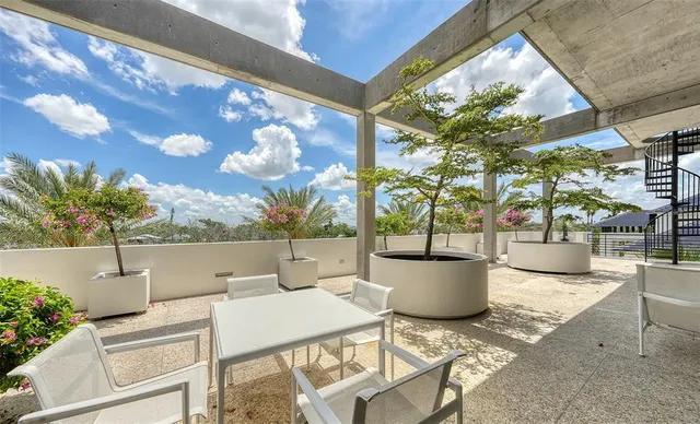 a view of a garden with an outdoor space