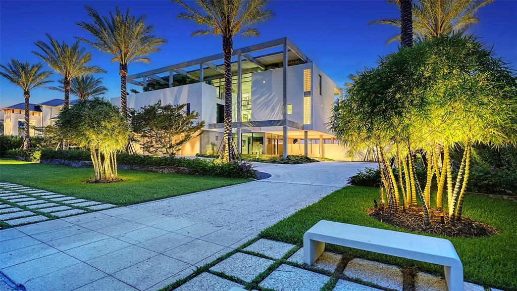 8250 Sanderling Road Sarasota, FL 34242 - Photo 10 of 61 a view of a chair and table in the yard