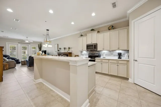 a kitchen with cabinets and white appliances