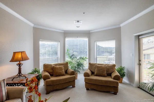 a living room with furniture and a window