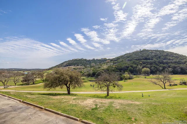 a view of an swimming pool and an outdoor seating