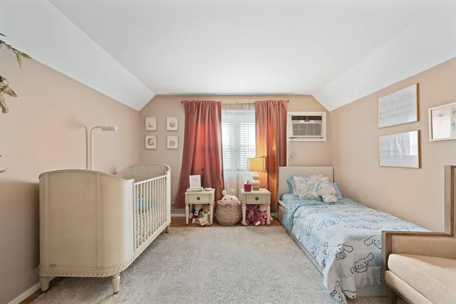 a bed room with furniture and a window