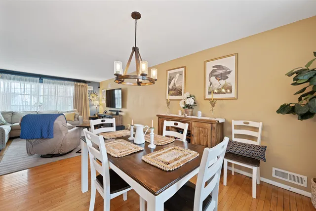 a view of a livingroom with furniture and a table