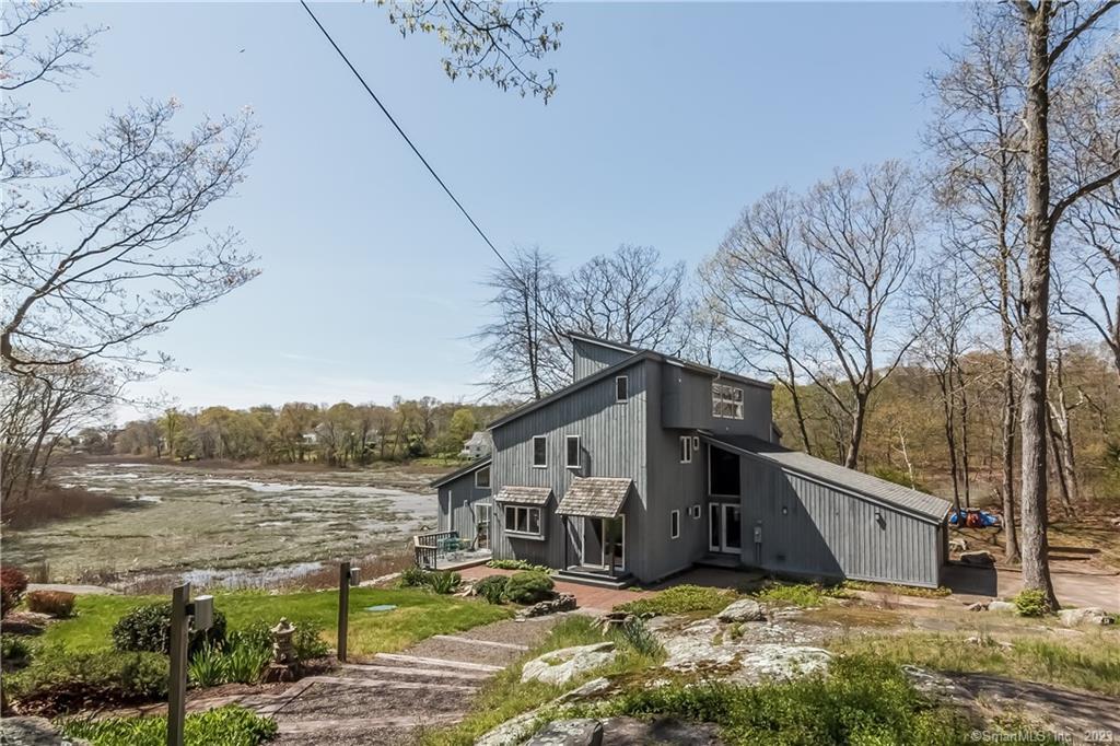 337 Mulberry Point Road Guilford, CT 06437 - Photo 1 of 1 a view of a house with a big yard
