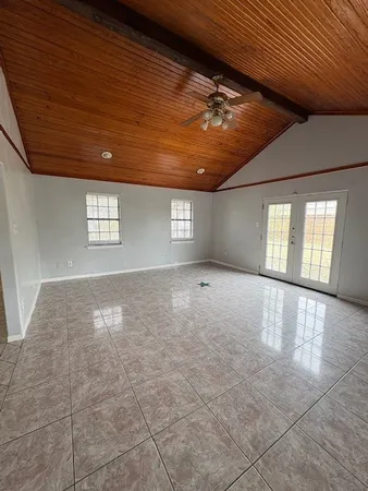 a view of an empty room and window