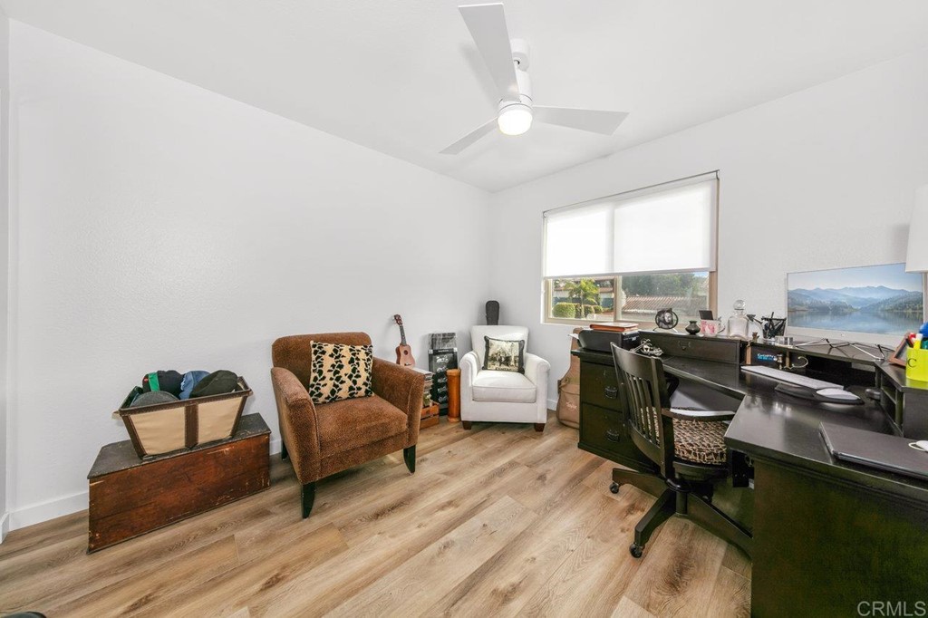 6972 Batiquitos Drive Carlsbad, CA 92011 - Photo 11 of 36 a living room with furniture and a flat screen tv