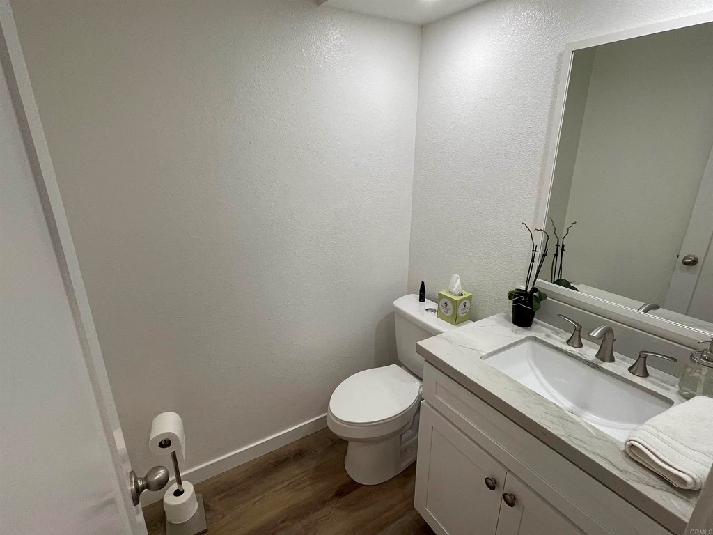 6972 Batiquitos Drive Carlsbad, CA 92011 - Photo 13 of 36 a bathroom with a sink a toilet and a mirror