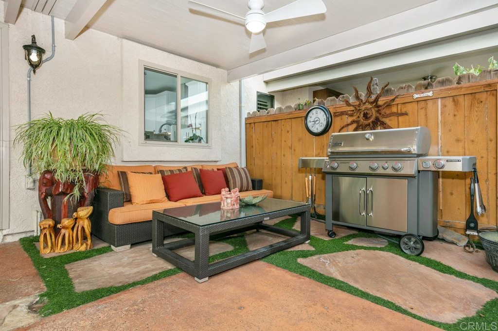 6972 Batiquitos Drive Carlsbad, CA 92011 - Photo 15 of 36 a living room with furniture a table and a potted plant