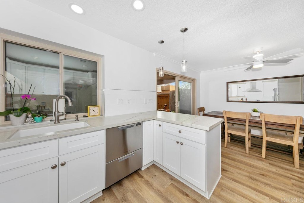 6972 Batiquitos Drive Carlsbad, CA 92011 - Photo 16 of 36 a spacious bathroom with a double vanity sink and a mirror