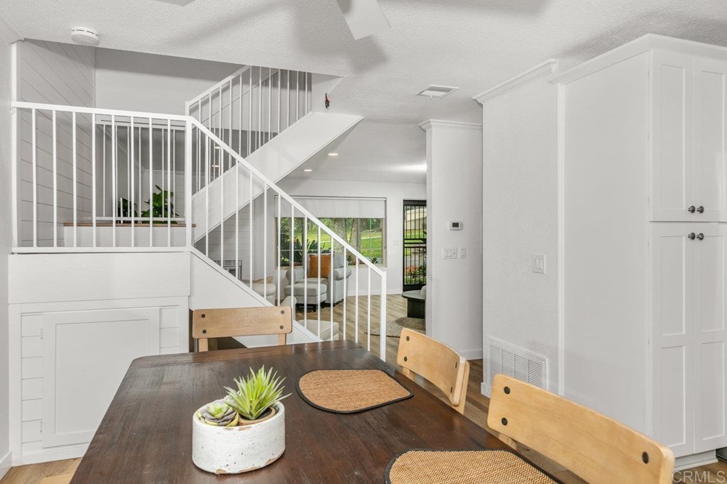 6972 Batiquitos Drive Carlsbad, CA 92011 - Photo 18 of 36 a living room with dining room and a table