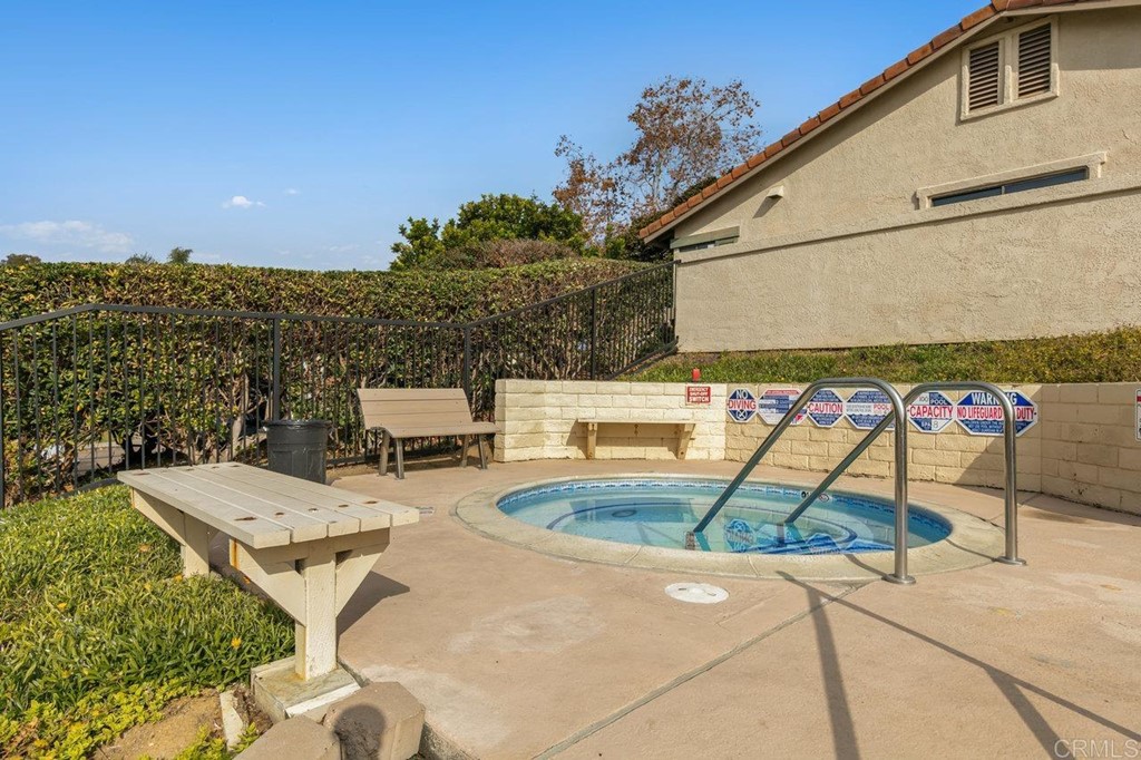 6972 Batiquitos Drive Carlsbad, CA 92011 - Photo 26 of 36 a view of a swimming pool with a patio and mountain view