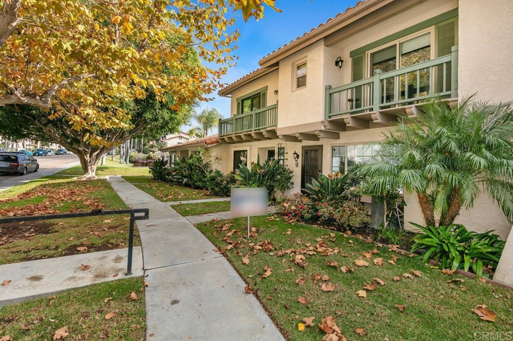 6972 Batiquitos Drive Carlsbad, CA 92011 - Photo 28 of 36 a front view of a house with garden